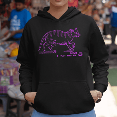 "I must feed my cat" medieval woodcut design unisex hoodie in black mock up - fthis