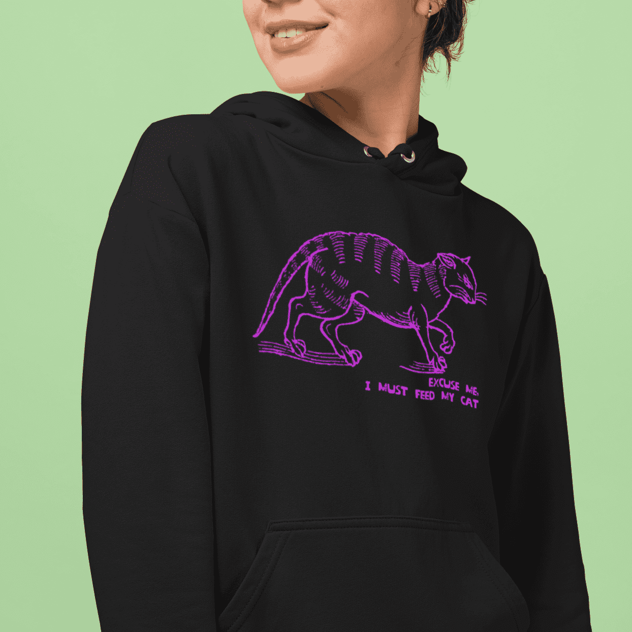 "I must feed my cat" medieval woodcut design women's hoodie in black mock up - fthis