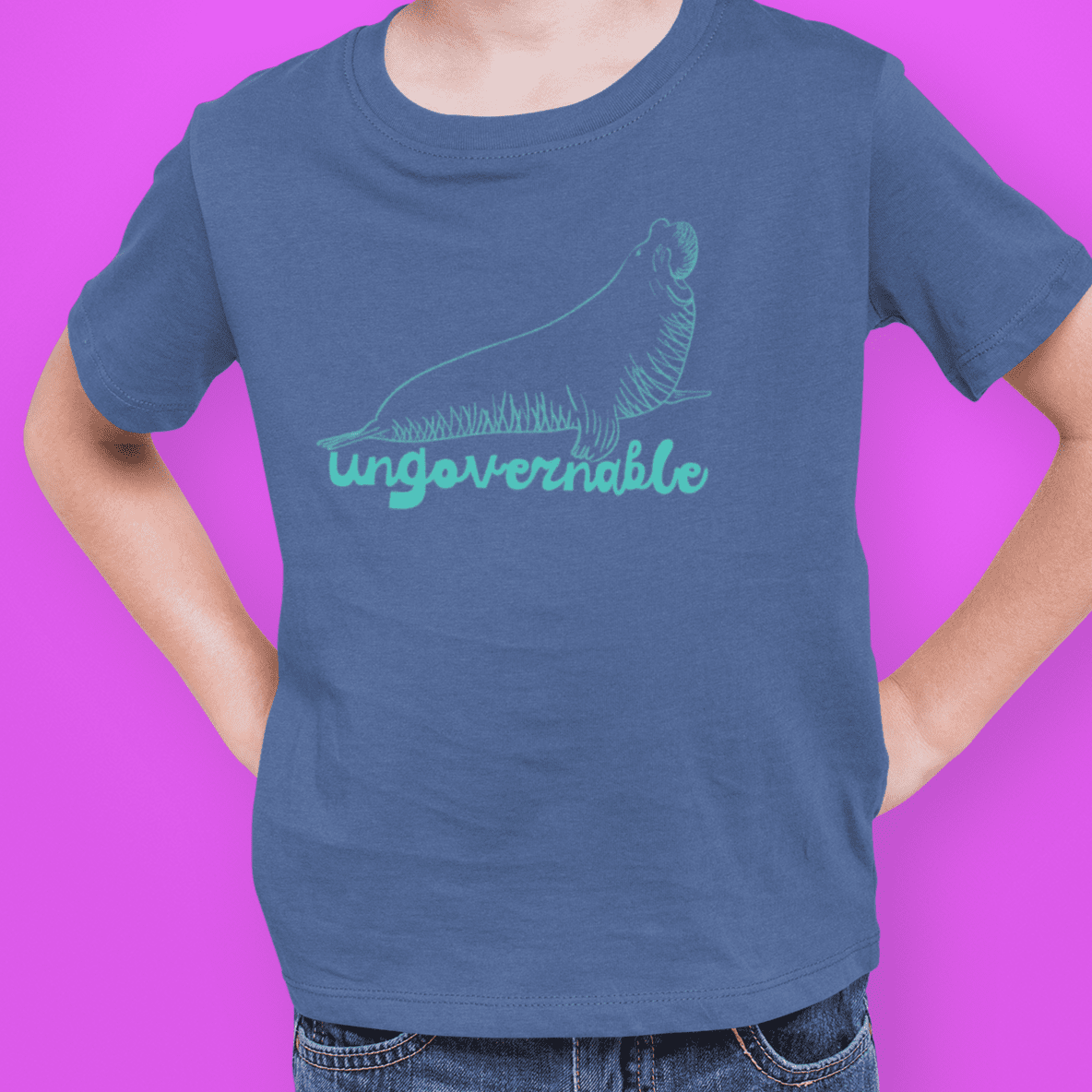 Neil the seal child in blue t-shirt with teal design - fthis