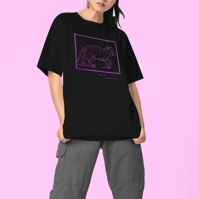 Woman modelling black staple t-shirt with medieval woodcut style illustration saying "may my dog also attend?"